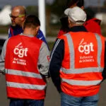FILE PHOTO: Workers on strike gather in front of the French oil giant TotalEnergies refinery in Donges