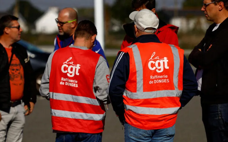 FILE PHOTO: Workers on strike gather in front of the French oil giant TotalEnergies refinery in Donges